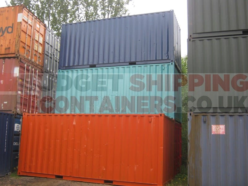 Stack of repainted shipping containers in different colours