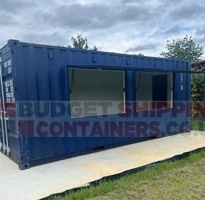 blue shipping container with two serving hatches