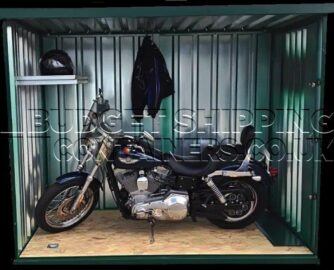 Motorbike inside storage unit with some shelving