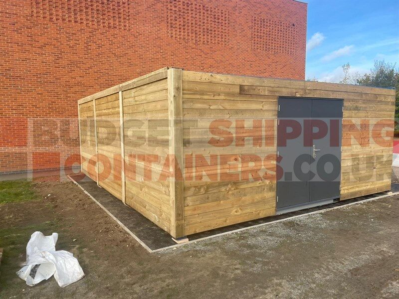 smartly cladded container with grey double doors in the side