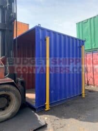 Smart looking blue 10ft shipping container with yellow jack legs and no front end