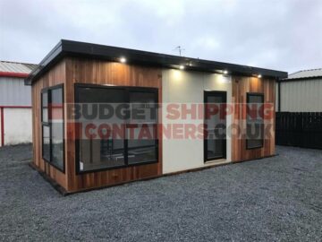 Smart cladded cabin with pitched roof and large windows