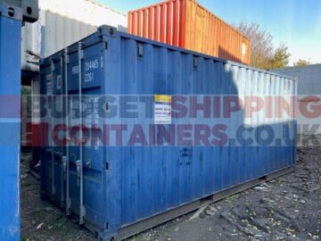 blue shipping container in pretty good condition, a little faded from age but still a smart unit
