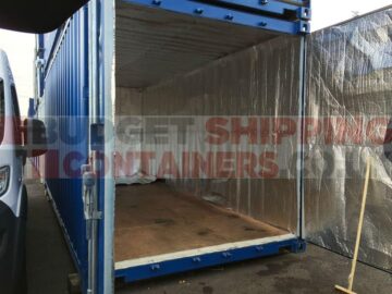 an empty shipping container lined in insulated material.