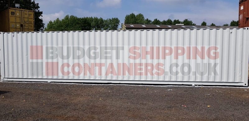 side view of repainted light grey shipping container