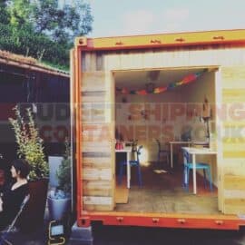 view inside open shipping container with an office built in