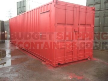 Repainted red shipping container with personnel door