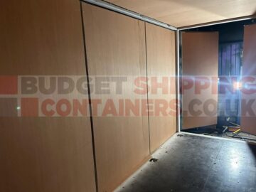 inside of a side opening shipping container with ply lining