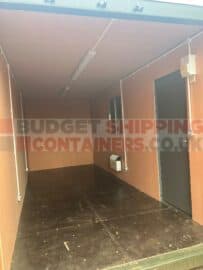 ply lined shipping container with strip lighting, window and personnel door