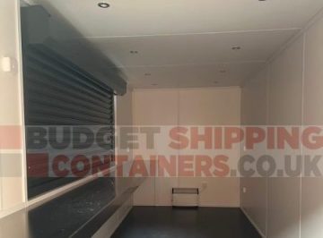 converted container with melamine lining and roller shutter