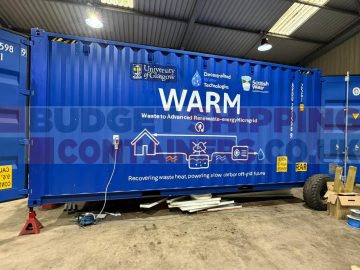 blue tunnel container with vinyl logos on the side advertising their project