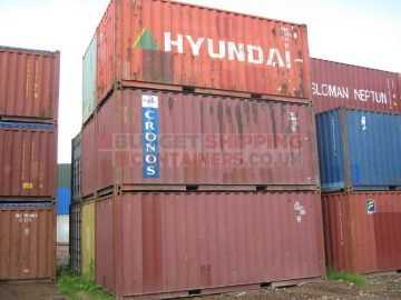 Stack of used 20ft shipping containers to show a rough idea of varying cosmetic conditions