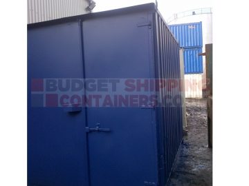 door view of refurbsihed 10ft continer showing easy open doors, rain guard and left hand side panel with some dents