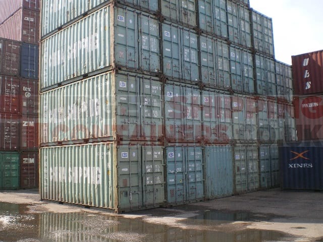 stack of used 20ft shipping containers