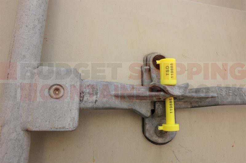 Bolt seal closed and attached to a shipping container door