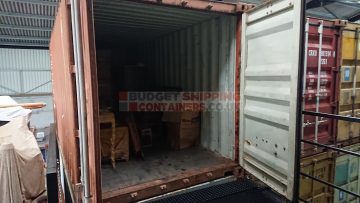 Container doors open onto staircase platform
